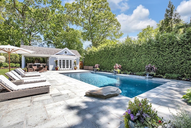 3120 Grathwohl Rd, New Suffolk, NY 11956 - view of swimming pool with an exterior structure, an outdoor structure, and a patio
