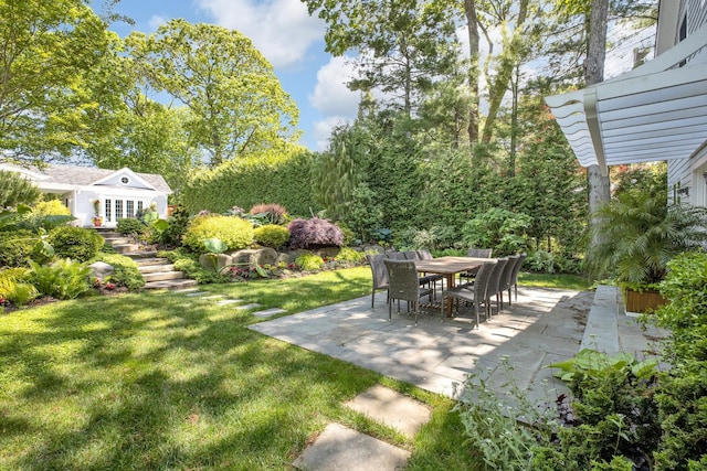 3120 Grathwohl Rd, New Suffolk, NY 11956 - view of green lawn with a patio area