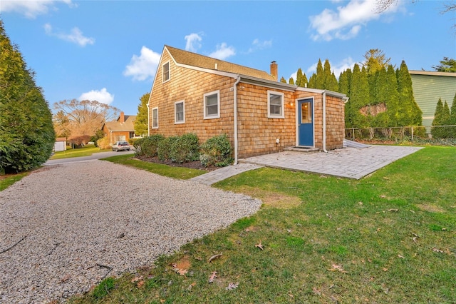 3120 Grathwohl Rd, New Suffolk, NY 11956 - rear view of house featuring a chimney and a patio