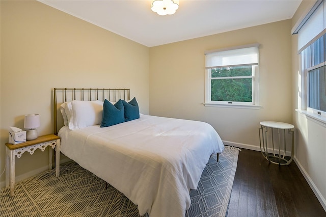 3120 Grathwohl Rd, New Suffolk, NY 11956 - bedroom with wood-type flooring and baseboards