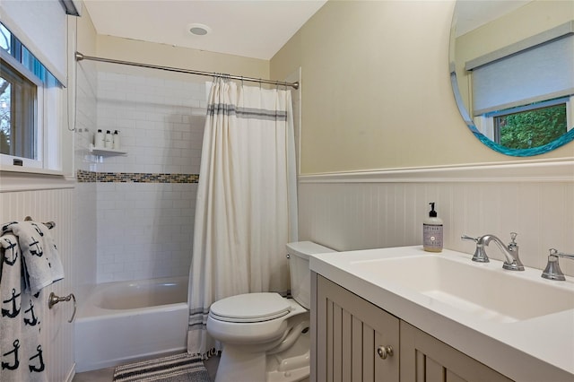 3120 Grathwohl Rd, New Suffolk, NY 11956 - full bath featuring wainscoting, vanity, and shower / tub combo