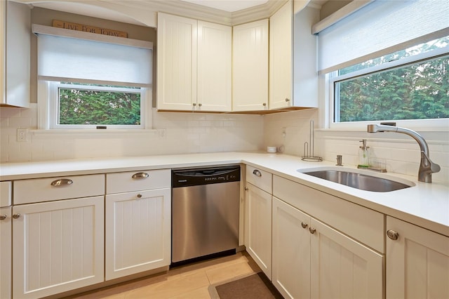 3120 Grathwohl Rd, New Suffolk, NY 11956 - kitchen featuring dishwasher, backsplash, light countertops, and light tile patterned floors