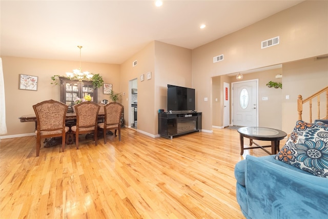 98 Virginia Ave, Plainview, NY 11803 - living area with light wood-style flooring, plenty of natural light, a chandelier, and recessed lighting