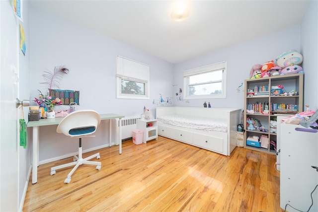 98 Virginia Ave, Plainview, NY 11803 - bedroom featuring radiator and wood finished floors