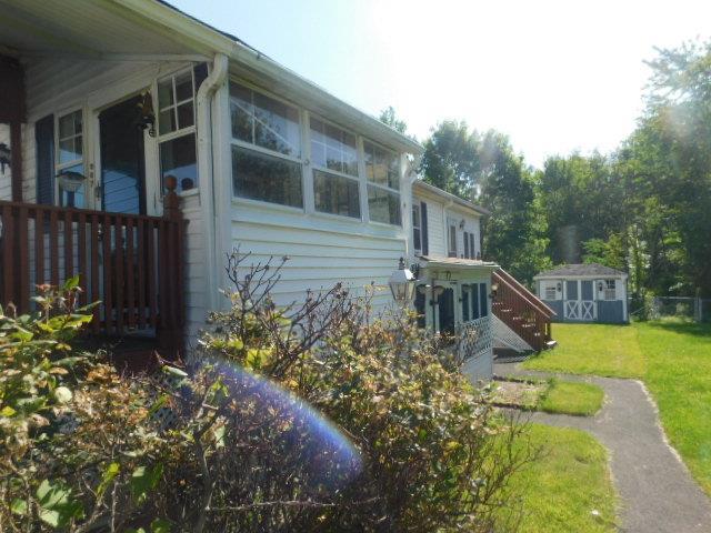 967 State Route 17k, Montgomery, NY 12549 - view of property exterior featuring a yard, a shed, and a sunroom