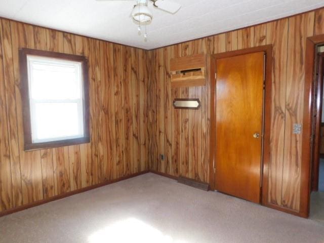 967 State Route 17k, Montgomery, NY 12549 - unfurnished room with wood walls and carpet