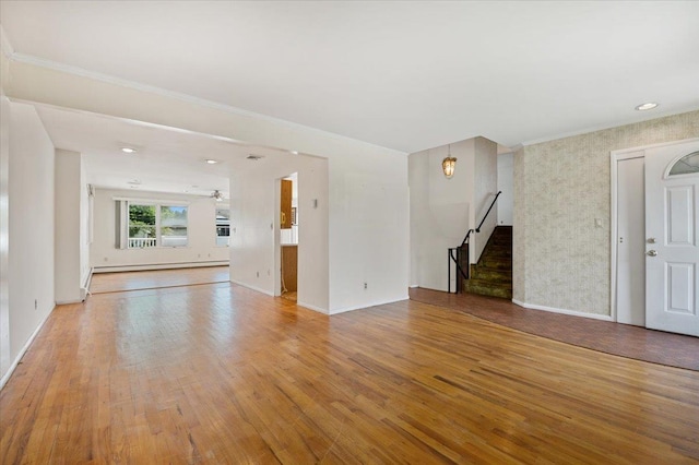 20 Deb St, Plainview, NY 11803 - unfurnished living room featuring a baseboard radiator, stairs, light wood finished floors, and crown molding