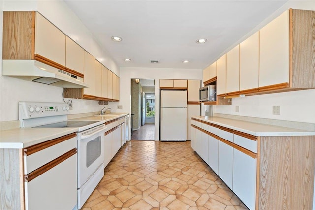 20 Deb St, Plainview, NY 11803 - kitchen featuring white appliances, under cabinet range hood, recessed lighting, and light countertops