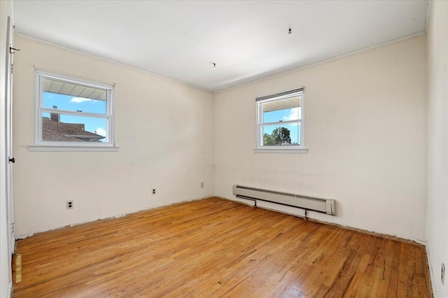 20 Deb St, Plainview, NY 11803 - spare room featuring a baseboard radiator and light wood-style flooring
