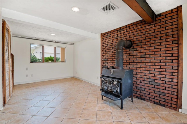 20 Deb St, Plainview, NY 11803 - unfurnished living room with beam ceiling, brick wall, a wood stove, light tile patterned floors, and recessed lighting