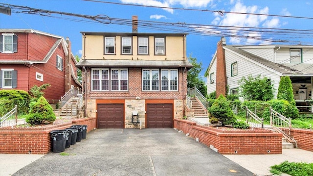 20 Overhill Pl, Yonkers, NY 10704 - multi unit property with stairway, asphalt driveway, a garage, and brick siding