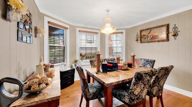20 Overhill Pl, Yonkers, NY 10704 - dining area featuring light wood finished floors, ornamental molding, and a chandelier