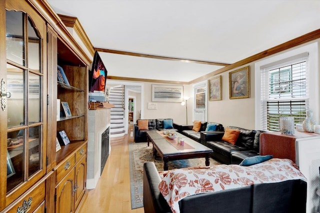 20 Overhill Pl, Yonkers, NY 10704 - living room featuring a fireplace with flush hearth, light wood-style floors, and crown molding