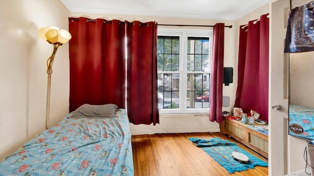 20 Overhill Pl, Yonkers, NY 10704 - bedroom featuring hardwood / wood-style flooring, ornamental molding, and radiator heating unit