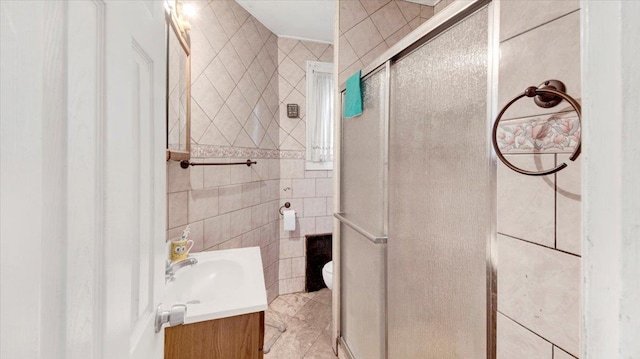 20 Overhill Pl, Yonkers, NY 10704 - bathroom featuring vanity, a stall shower, tile walls, and tile patterned floors