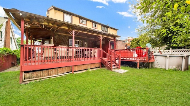 20 Overhill Pl, Yonkers, NY 10704 - rear view of property with a yard, a wooden deck, and stucco siding