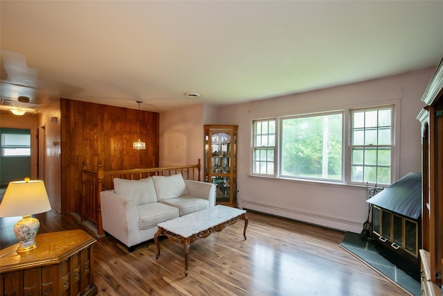 180 Hunter Ave, North Babylon, NY 11703 - living room with a baseboard radiator and wood finished floors