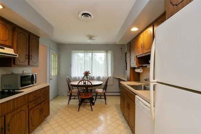 180 Hunter Ave, North Babylon, NY 11703 - kitchen with white appliances, light floors, plenty of natural light, light countertops, and recessed lighting