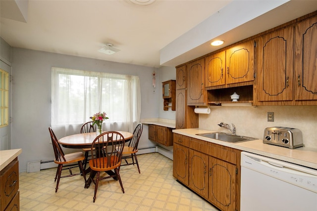 180 Hunter Ave, North Babylon, NY 11703 - kitchen featuring dishwasher, light flooring, light countertops, and brown cabinets