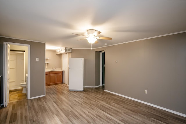 180 Hunter Ave, North Babylon, NY 11703 - unfurnished living room with ceiling fan, wood finished floors, and crown molding