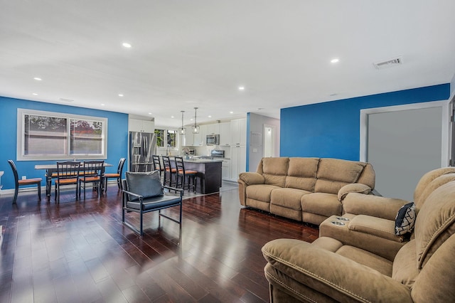 15 Aron Dr, Bohemia, NY 11716 - living room with recessed lighting and dark wood-style flooring