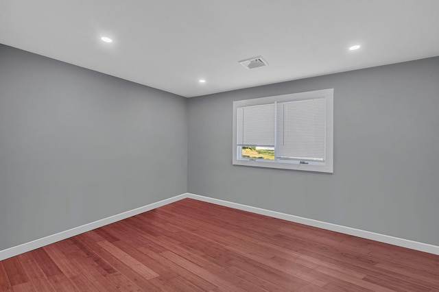 15 Aron Dr, Bohemia, NY 11716 - spare room featuring wood finished floors and recessed lighting