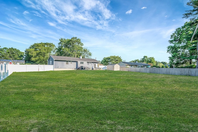 15 Aron Dr, Bohemia, NY 11716 - fenced backyard featuring a storage unit