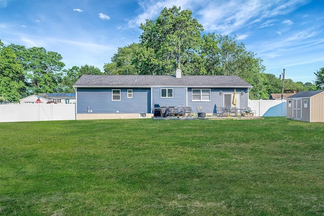 15 Aron Dr, Bohemia, NY 11716 - rear view of property featuring a shed, a fenced backyard, a patio area, and a chimney