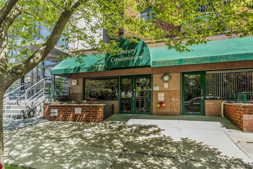 83-71 116th St Unit 4D, Kew Gardens, NY 11418 - back of property with stucco siding and french doors