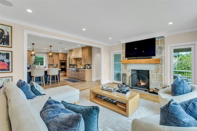 52 Concourse E, Brightwaters, NY 11718 - living room featuring ornamental molding, a fireplace, light wood-style floors, and recessed lighting