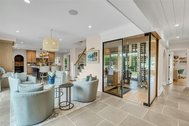 52 Concourse E, Brightwaters, NY 11718 - living room with recessed lighting, stairs, light tile patterned flooring, and a chandelier
