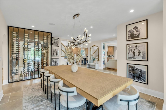 52 Concourse E, Brightwaters, NY 11718 - dining room featuring stairway, a chandelier, recessed lighting, and light tile patterned floors