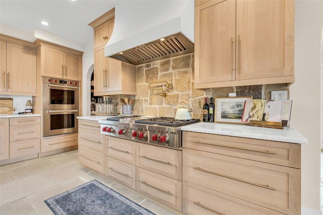 52 Concourse E, Brightwaters, NY 11718 - kitchen featuring custom exhaust hood, light brown cabinets, stainless steel appliances, tasteful backsplash, and recessed lighting