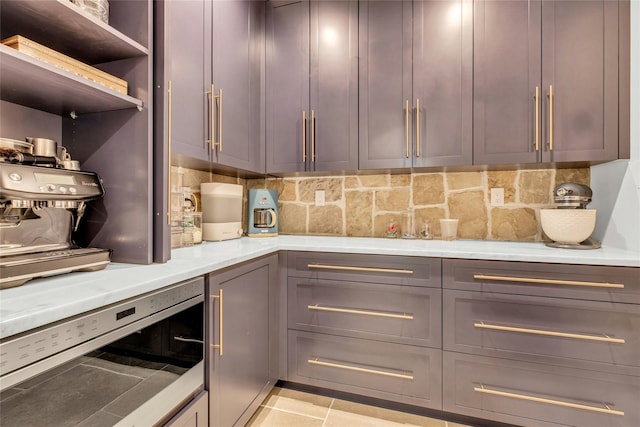 52 Concourse E, Brightwaters, NY 11718 - kitchen with backsplash, gray cabinetry, beverage cooler, light tile patterned floors, and open shelves