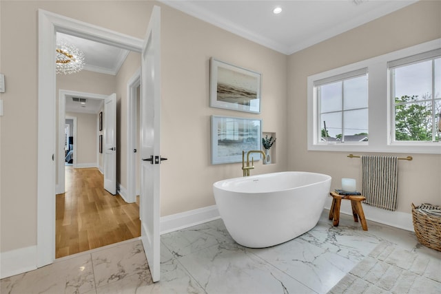 52 Concourse E, Brightwaters, NY 11718 - bathroom with radiator heating unit, marble look tile flooring, a soaking tub, crown molding, and recessed lighting
