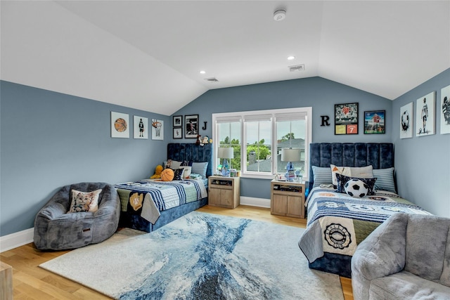 52 Concourse E, Brightwaters, NY 11718 - bedroom with vaulted ceiling and light wood-style floors