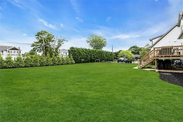 52 Concourse E, Brightwaters, NY 11718 - view of grassy yard featuring stairway and a deck