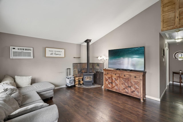 17 Lombardy Dr, Shirley, NY 11967 - living area featuring a wood stove, an AC wall unit, wood finished floors, and vaulted ceiling
