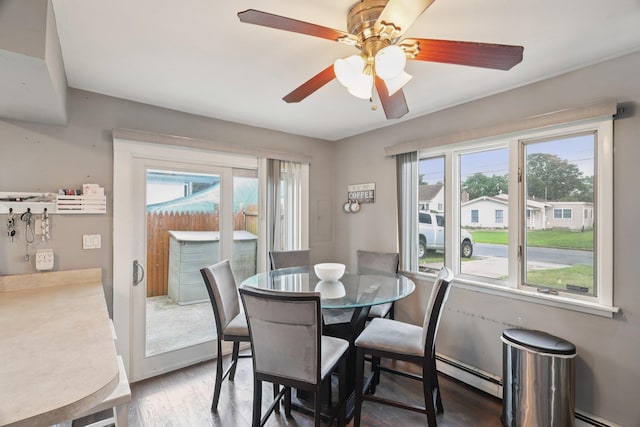 17 Lombardy Dr, Shirley, NY 11967 - dining area featuring plenty of natural light, wood finished floors, a ceiling fan, and a baseboard radiator