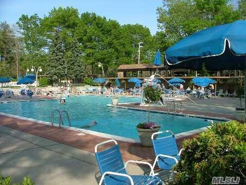 2 Guilford Ct Unit B, Ridge, NY 11961 - community pool featuring a patio area