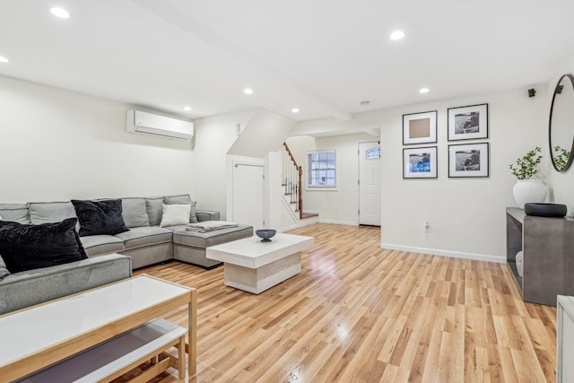 652 Arthur St, Baldwin Harbor, NY 11510 - living area with a wall mounted AC, stairs, light wood-style flooring, and recessed lighting