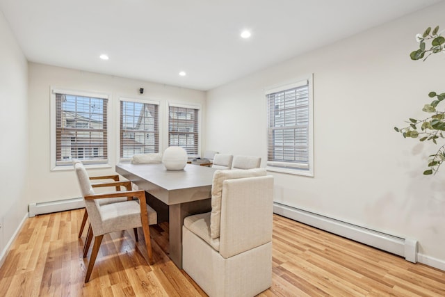 652 Arthur St, Baldwin Harbor, NY 11510 - dining area with a baseboard heating unit, light wood finished floors, healthy amount of natural light, and recessed lighting
