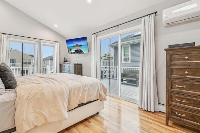 652 Arthur St, Baldwin Harbor, NY 11510 - bedroom with a wall unit AC, a baseboard radiator, access to outside, lofted ceiling, and light wood-type flooring