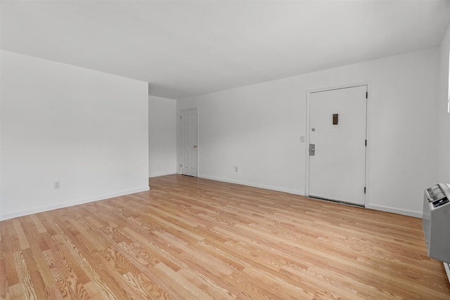 14 E White Gate Rd, Wappingers Falls, NY 12590 - unfurnished living room featuring light wood-style floors and baseboards