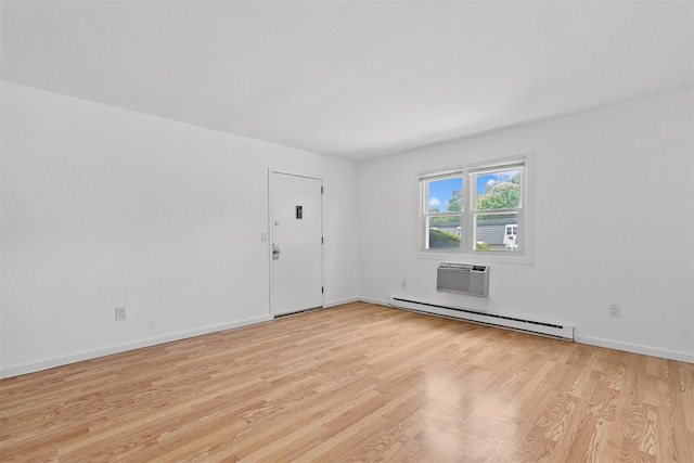 14 E White Gate Rd, Wappingers Falls, NY 12590 - unfurnished room with baseboard heating, light wood-style floors, and a wall mounted air conditioner