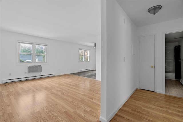 14 E White Gate Rd, Wappingers Falls, NY 12590 - empty room featuring baseboard heating, wood finished floors, and a wall unit AC