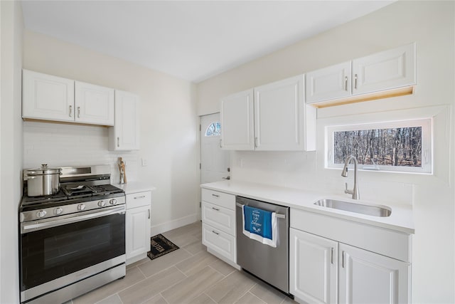 111/2 Dolson Ave, Middletown, NY 10940 - kitchen featuring appliances with stainless steel finishes, tasteful backsplash, light countertops, and white cabinets