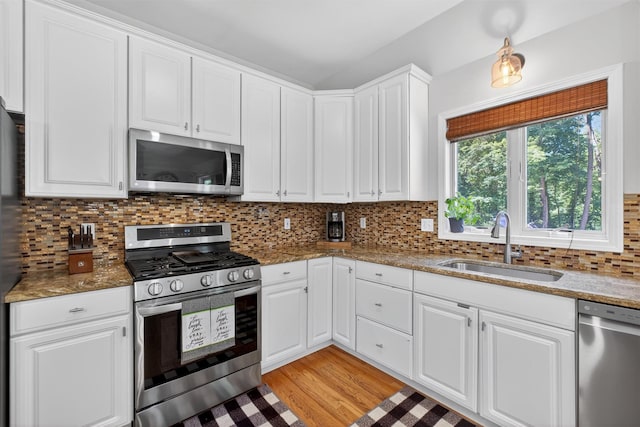 311 Myers Corners Rd, Wappingers Falls, NY 12590 - kitchen featuring stainless steel appliances, white cabinetry, stone counters, backsplash, and light wood-style floors