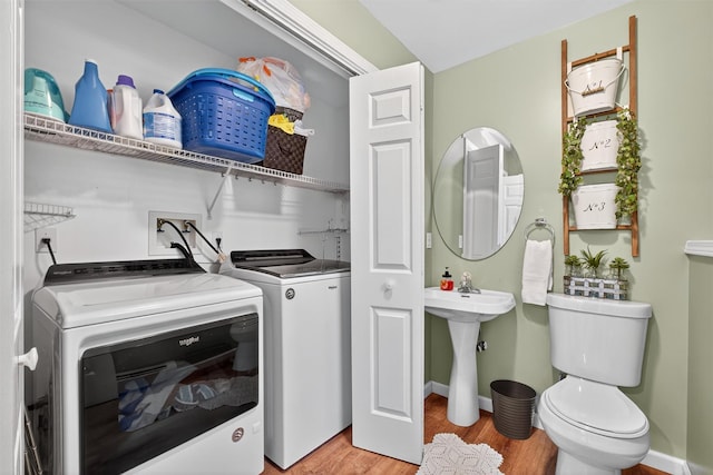 311 Myers Corners Rd, Wappingers Falls, NY 12590 - washroom with washer and clothes dryer and light wood-style flooring