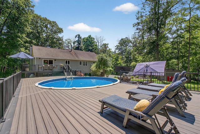311 Myers Corners Rd, Wappingers Falls, NY 12590 - view of swimming pool featuring a wooden deck and view of wooded area